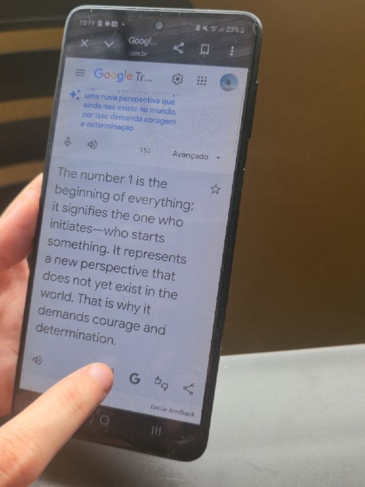 The translator app held in a hand between the two of them